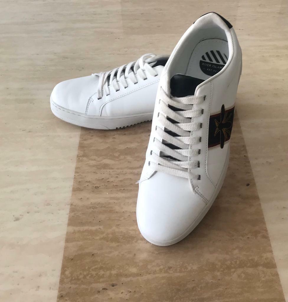 trainers with a bee logo